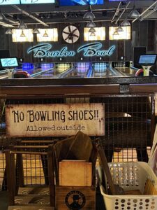 A sign that says no bowling shoes allowed outside.